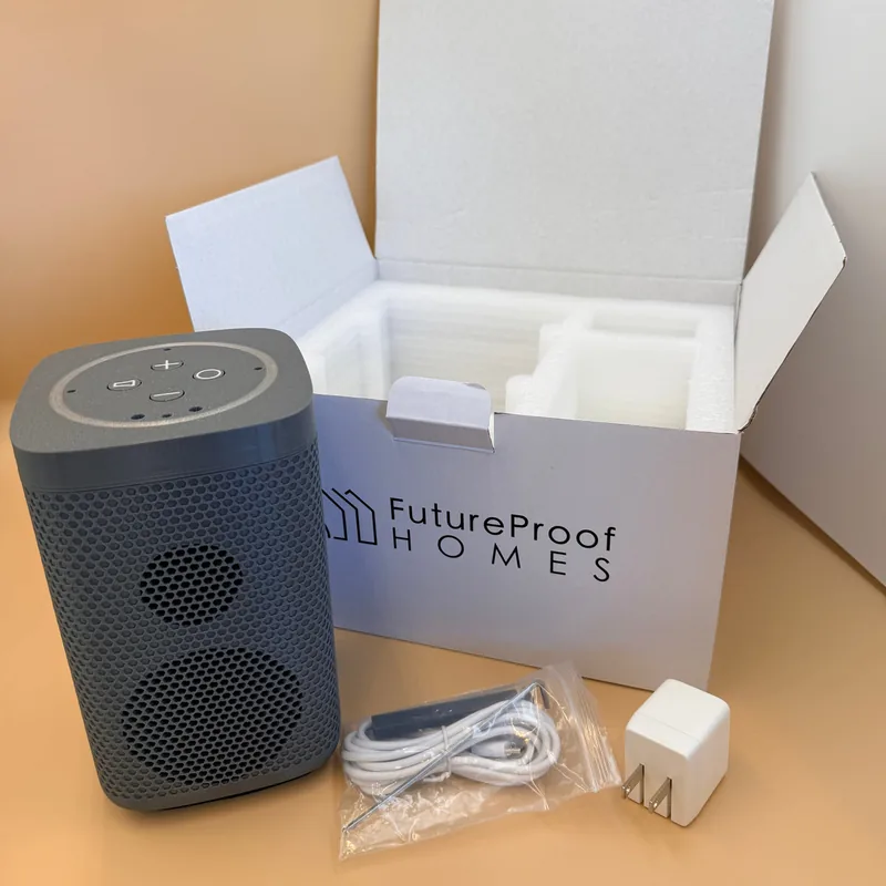 Satellite1.1 speaker beside its box, cable, power adapter and hex wrench